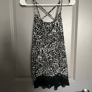 Black and  cream tank with strappy back detail and lace on the bottom
